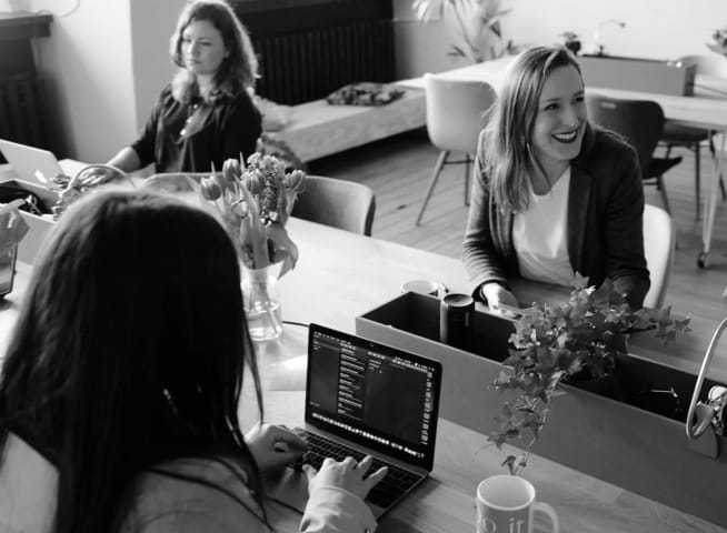 colleagues sitting at an office desk